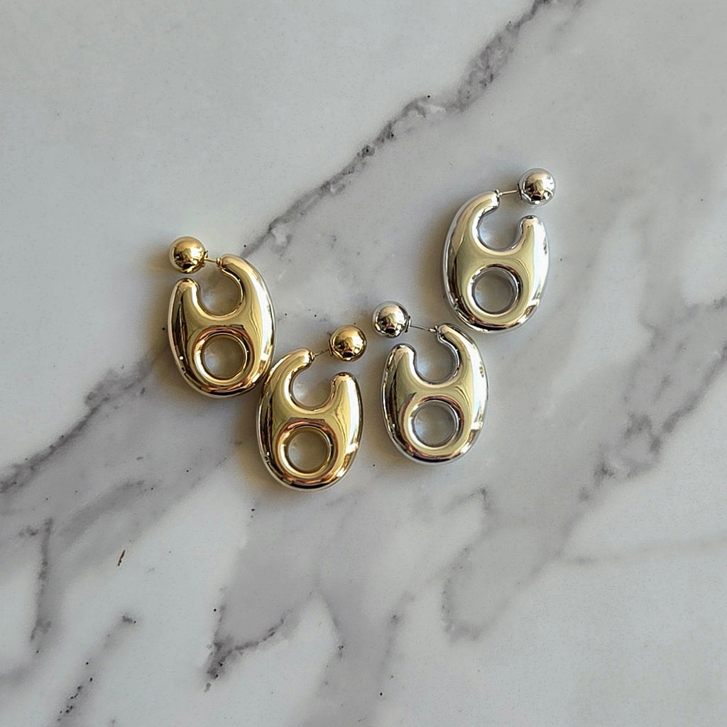 Brinco Órbita – ABS (Dourado/Prata) | Leve | Moderno