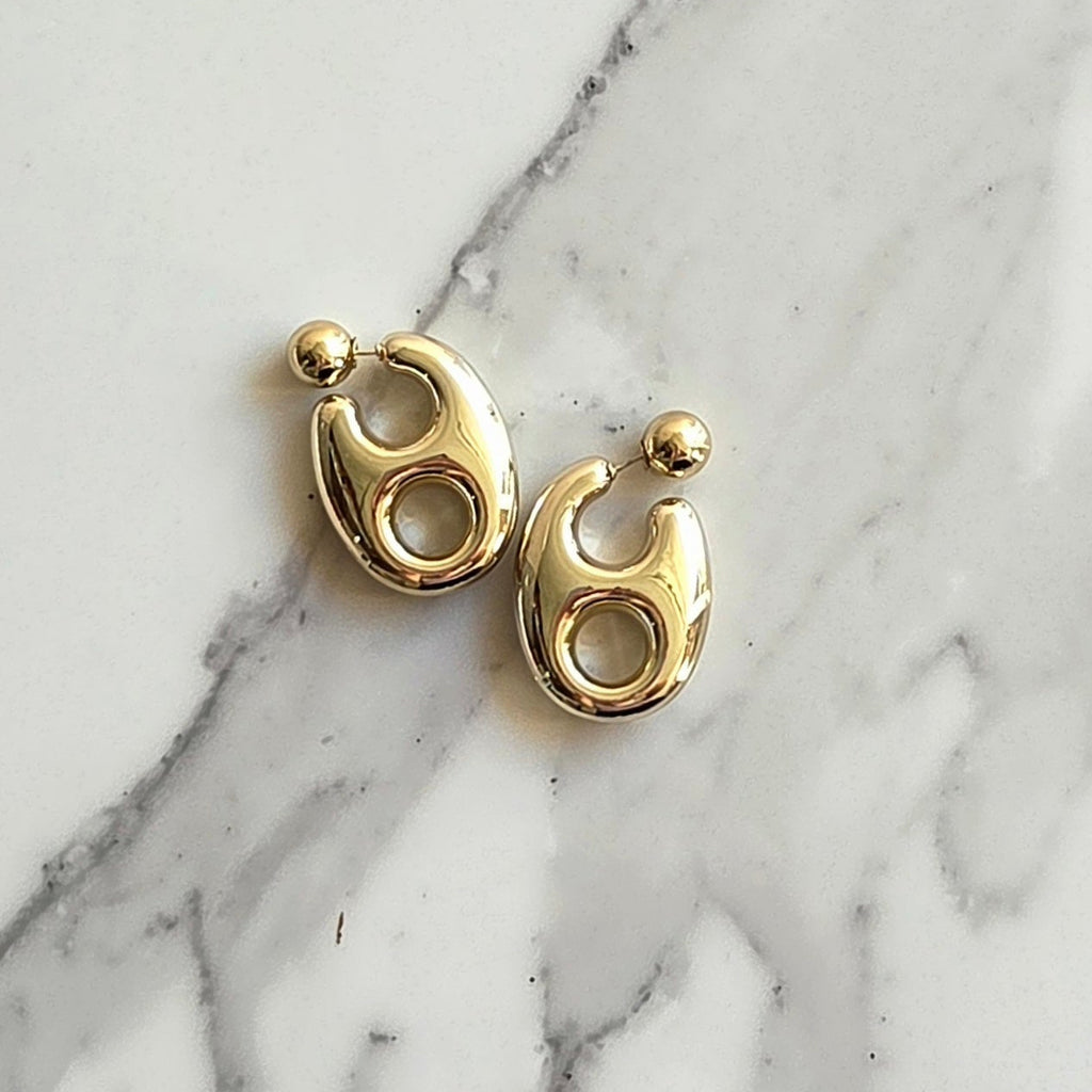 Brinco Órbita – ABS (Dourado/Prata) | Leve | Moderno